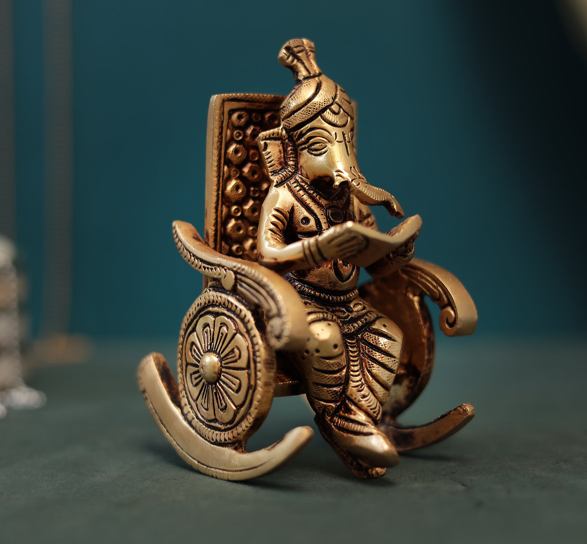 Superfine Reading Ganesha Sitting On Rocking Chair